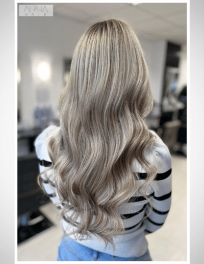 Stunning blonde makeover with beach waves created by Alpha Hair Studio